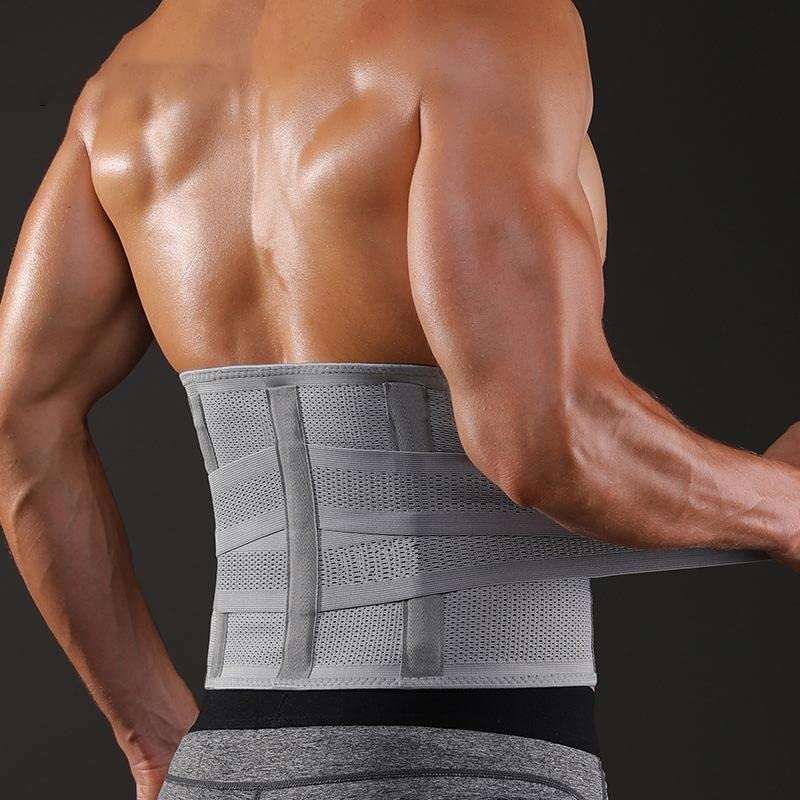 Man wearing grey back support belt with contoured lumbar sacral design for posture and pain relief