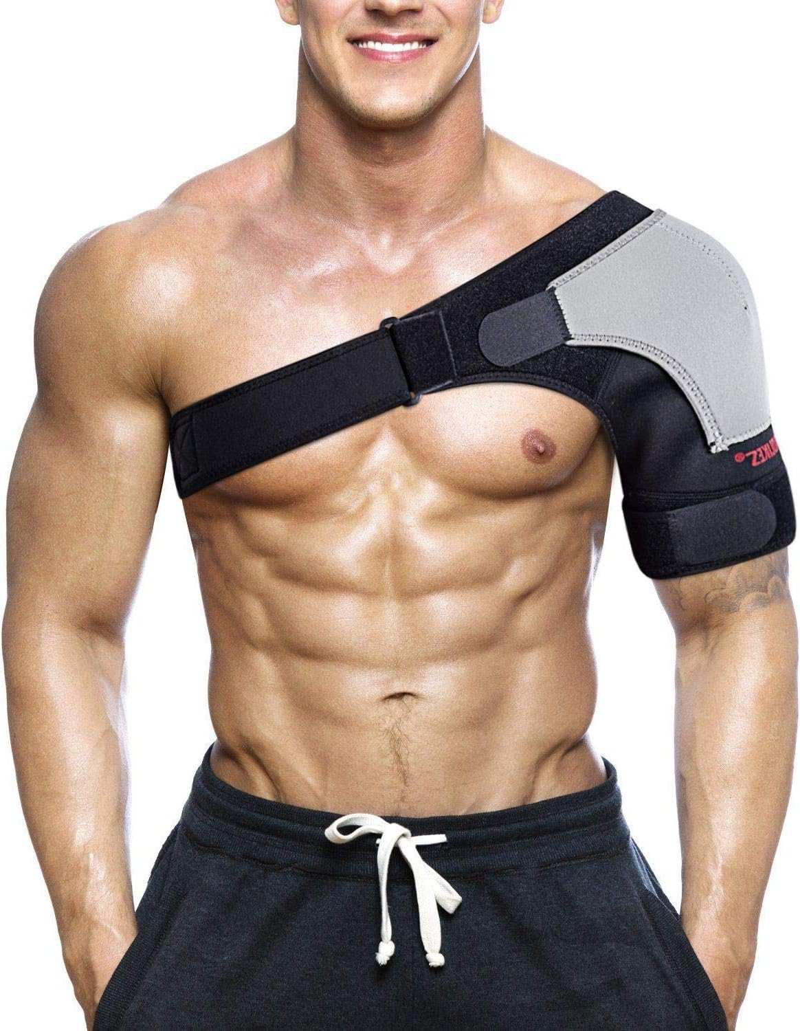 Man wearing a black and gray shoulder brace with compression support and adjustable straps