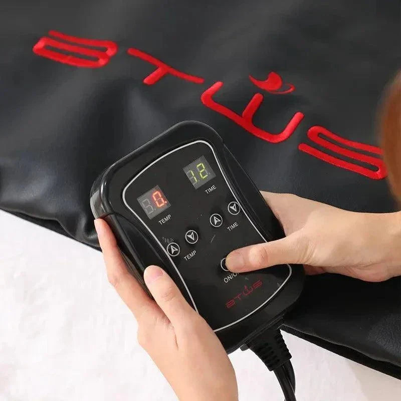 Portable infrared sauna blanket remote control for adjustable temperature and time settings in black thermal leather design