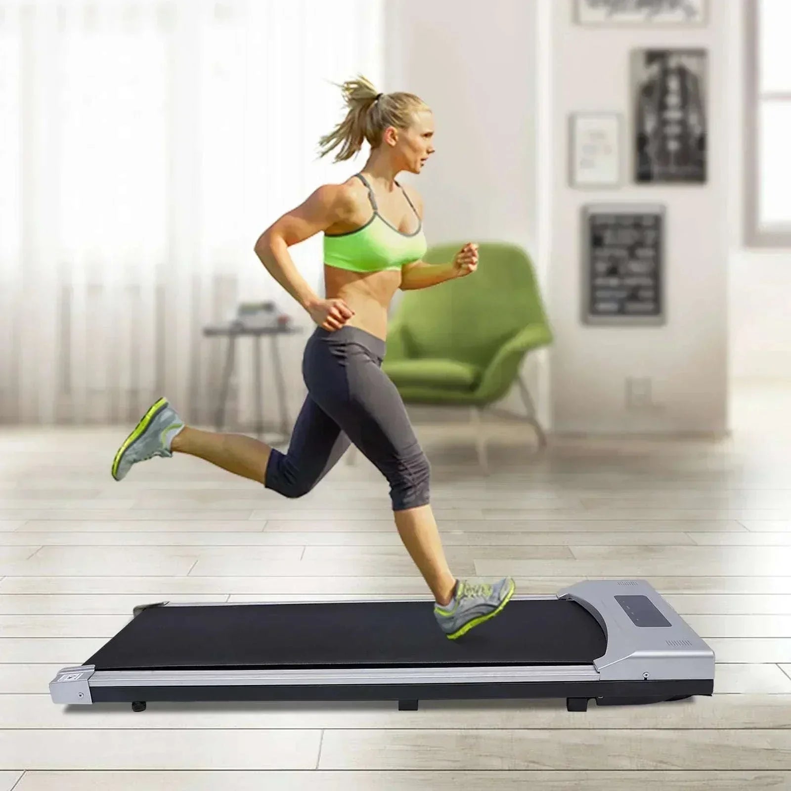 Woman running on a portable electric treadmill with remote control in modern living room