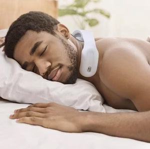 Man using Intelligent Neck Massager with TENS therapy and heat for neck pain relief