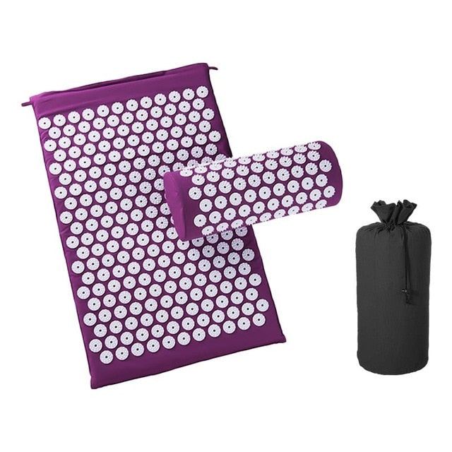 Purple acupressure cushion and massage mat set with white plastic spikes and black storage bag for pain relief and relaxation